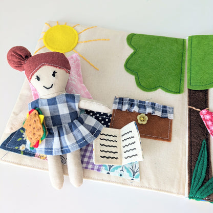 Close-up of the handmade fabric Adventure Book showing stitched details and scrap fabric textures.